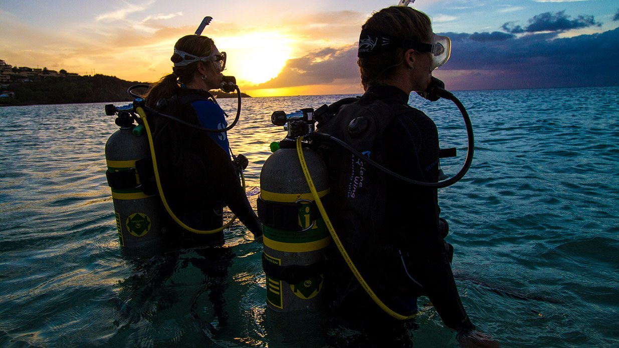 divers at sunset about to dive nitrox