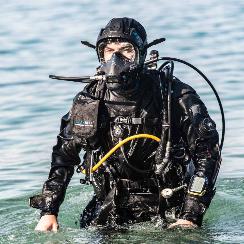 instructor exiting the water wearing the Ocean Reef Neptune 3 full face mask